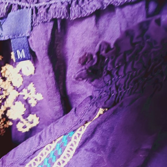 Purple, with gold and aqua color design stitching. Long sleeve crop top. - Picture 7 of 7